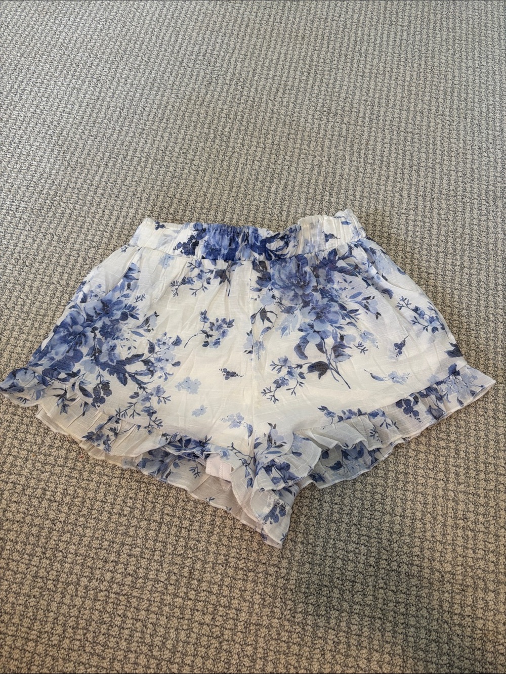 Francesca’s blue and white floral ruffle shorts